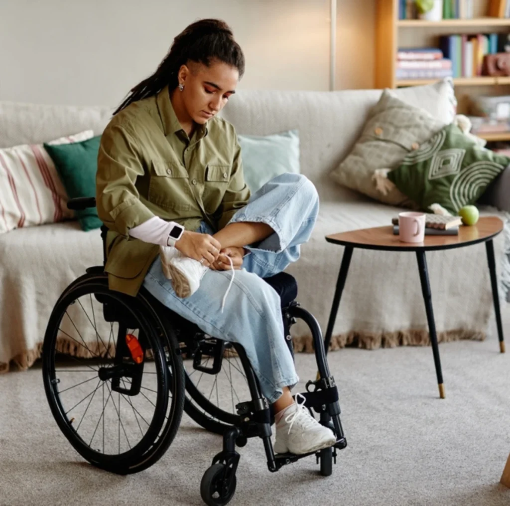 disabled women sitting on wheelchair and exercising