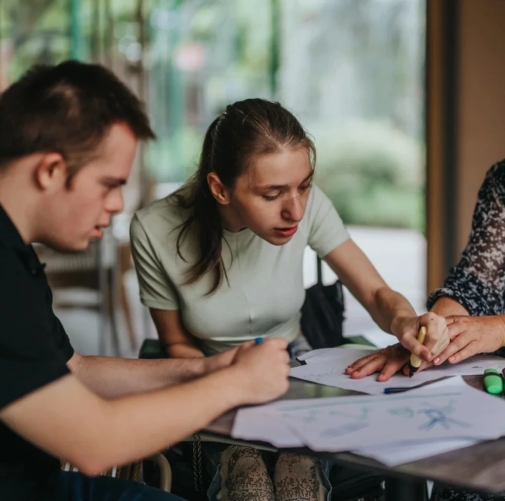 tutor helping disabled kids with studies